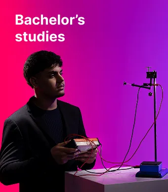 A KTU Faculty of Mathematics and Natural Sciences student working with experimental physics equipment against a pink and violet decorative background. The faculty offers bachelor's studies. Choose KTU bachelor's studies.