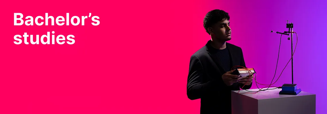 A KTU Faculty of Mathematics and Natural Sciences student working with experimental physics equipment against a pink and violet decorative background. The faculty offers bachelor's studies. Choose KTU bachelor's studies.